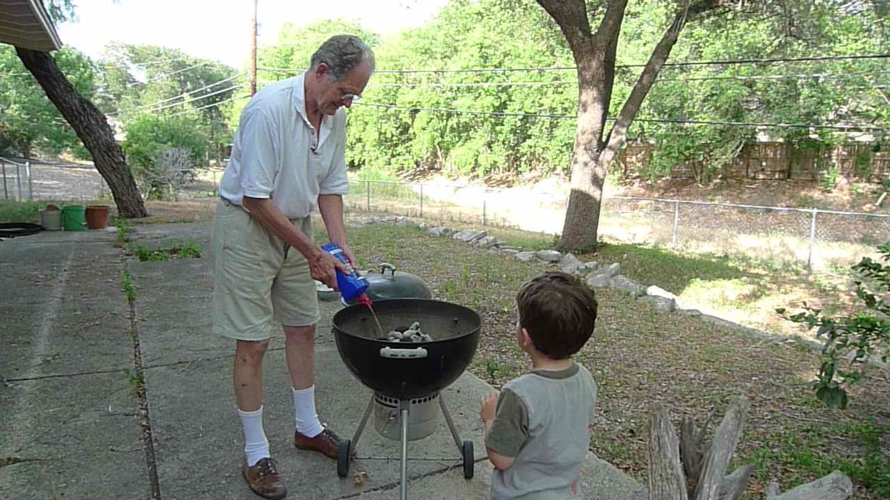 helping grandpa with the fire for dinner,